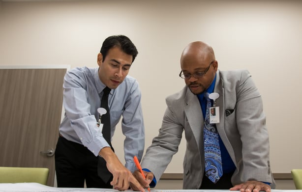 HHS linen experts conducting an on-site evaluation to identify opportunities for laundry system improvement and transparency