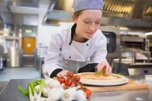 female chef with pizza