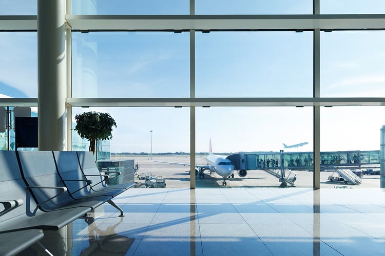 aviation_website_0000_airport services-get in touch-airport termainal window-blue hue