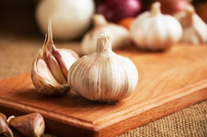 garlic on wood cutting board