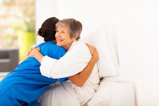 Team member caring for senior living resident